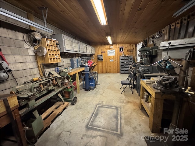 misc room featuring a workshop area and wooden ceiling