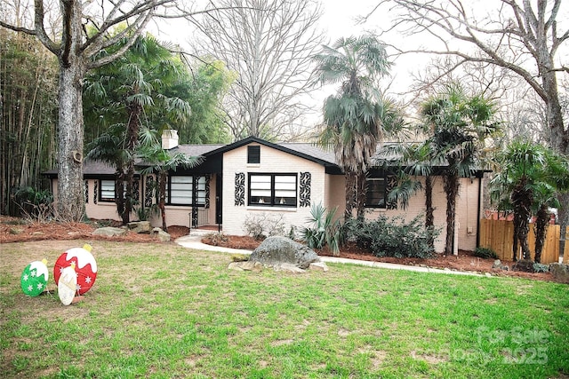 ranch-style home with a front yard