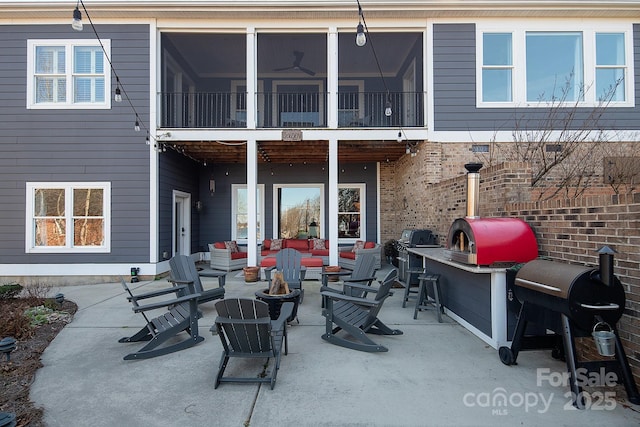 rear view of property featuring a patio and exterior bar