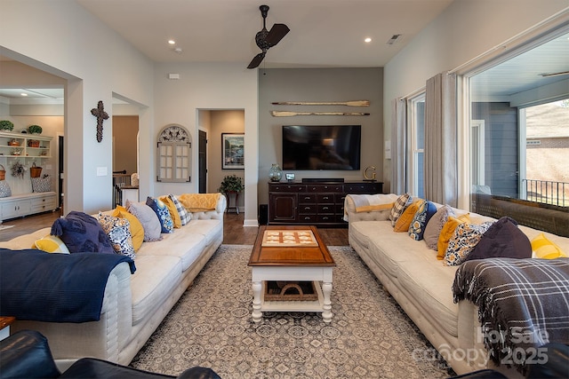 living room featuring hardwood / wood-style flooring and ceiling fan