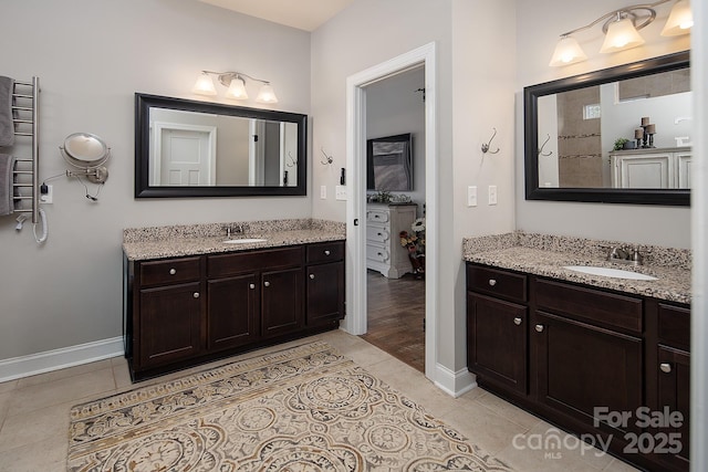 bathroom with vanity and tile patterned flooring