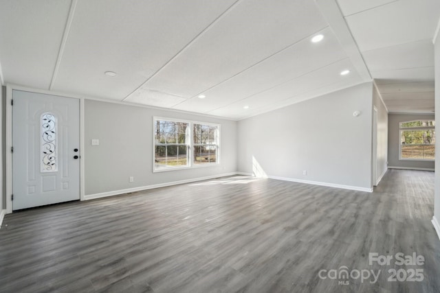 unfurnished living room with wood-type flooring and vaulted ceiling