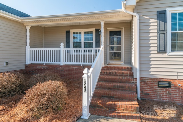 property entrance featuring a porch