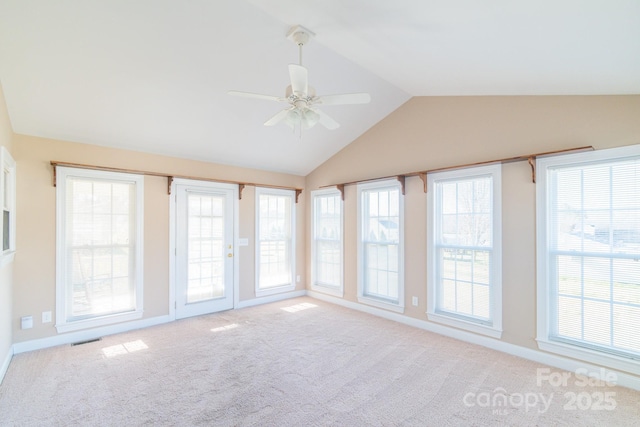 unfurnished sunroom featuring vaulted ceiling and ceiling fan