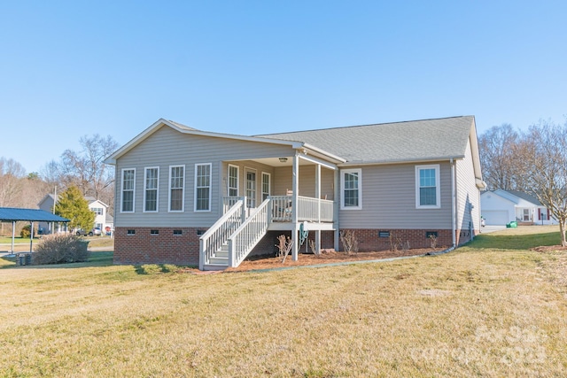 view of front of property with a front yard and covered porch