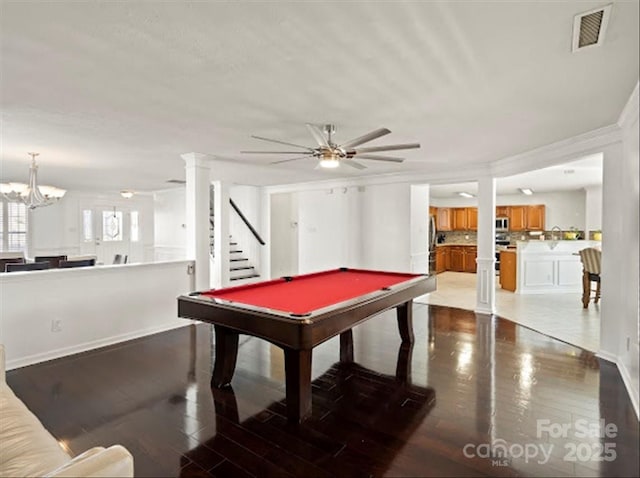 recreation room featuring ceiling fan with notable chandelier, light hardwood / wood-style floors, and billiards