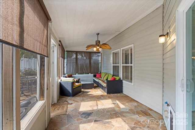 sunroom with ceiling fan, vaulted ceiling, and wooden ceiling