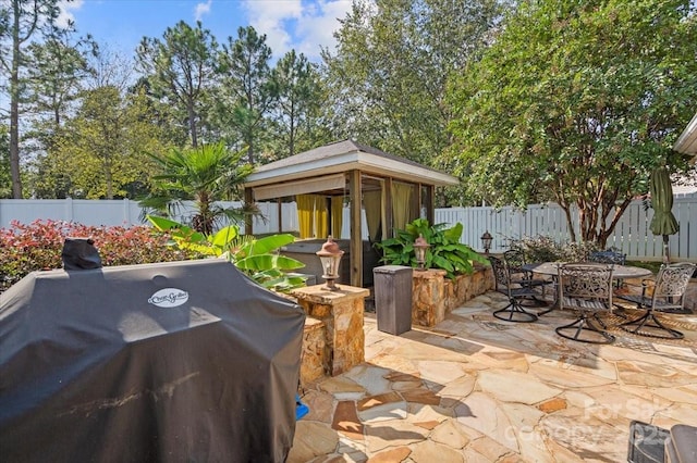 view of patio / terrace featuring a gazebo and grilling area