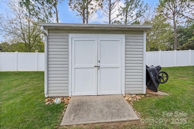 view of outdoor structure with a yard