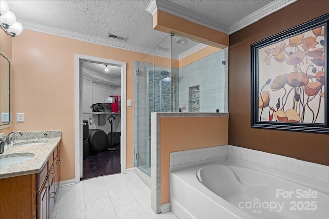 bathroom with shower with separate bathtub, ornamental molding, vanity, tile patterned floors, and a textured ceiling