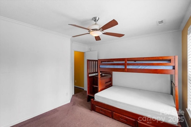 carpeted bedroom with crown molding and ceiling fan