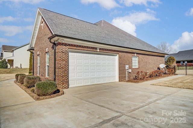 view of side of home featuring a garage