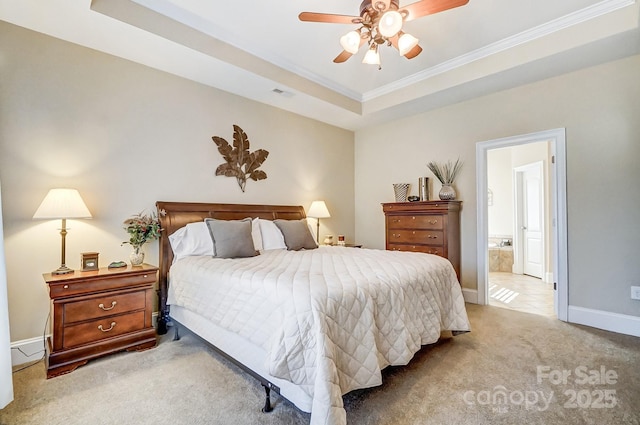 carpeted bedroom with ornamental molding, ceiling fan, and a tray ceiling