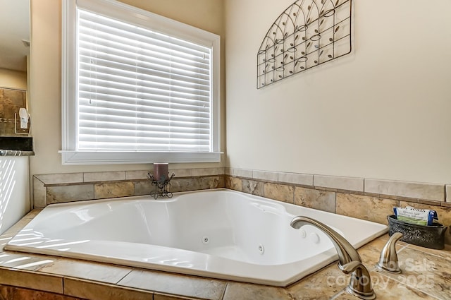 bathroom with tiled tub