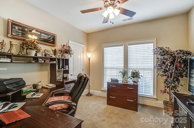 office space with ceiling fan and light carpet