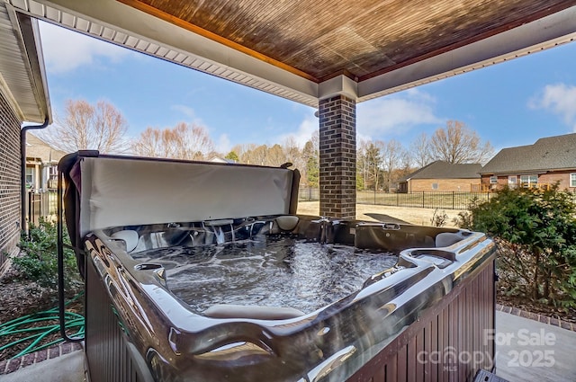 view of patio / terrace with a hot tub