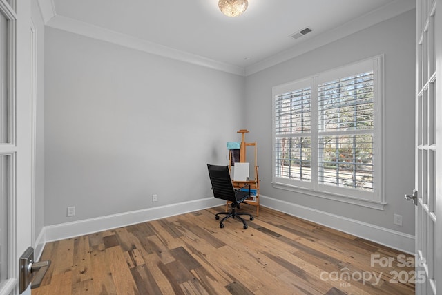 office area with ornamental molding and wood-type flooring