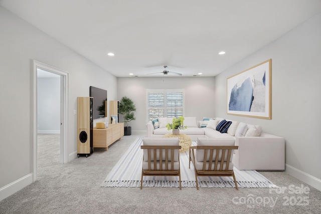 living room with light colored carpet and ceiling fan