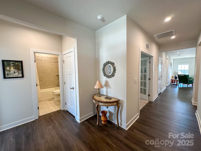 hall with dark wood-type flooring