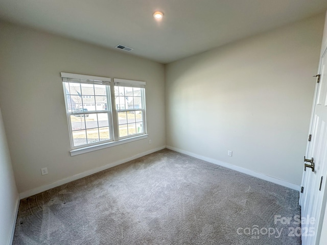view of carpeted spare room