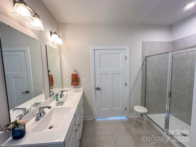 bathroom with vanity, tile patterned flooring, and a shower with door