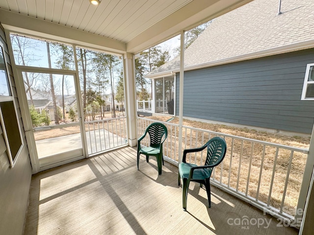 sunroom with wooden ceiling