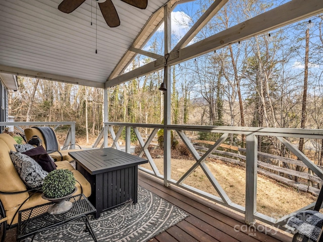 sunroom / solarium with vaulted ceiling and ceiling fan