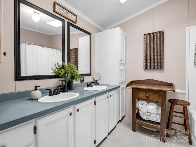 bathroom featuring crown molding, vanity, tile patterned flooring, and a textured ceiling