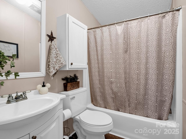 full bathroom featuring vanity, a textured ceiling, shower / bath combo, and toilet