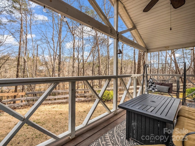 wooden terrace featuring ceiling fan