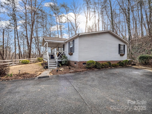 view of side of property featuring a porch