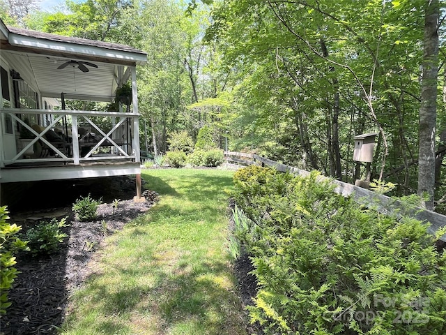 243 Buffalo Creek Rd, Lake Lure, NC 28746 - view of grassy yard with a ceiling fan and a deck