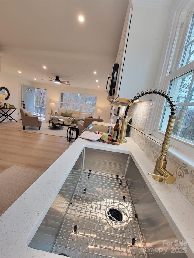 room details featuring ceiling fan and wood-type flooring