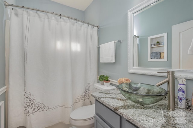 bathroom featuring vanity and toilet