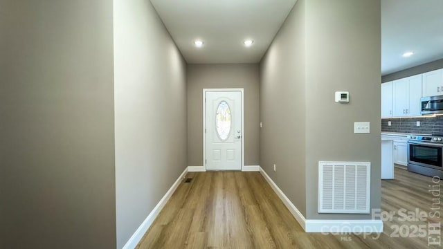 doorway featuring light wood-type flooring