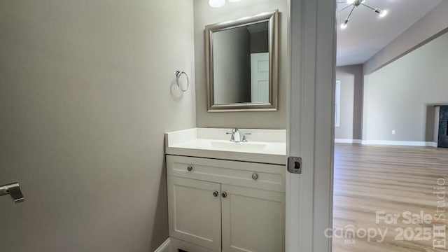 bathroom featuring vanity and wood-type flooring