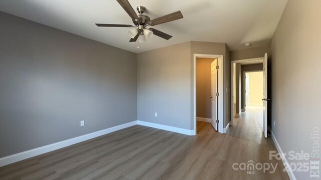 unfurnished room featuring ceiling fan and light hardwood / wood-style flooring