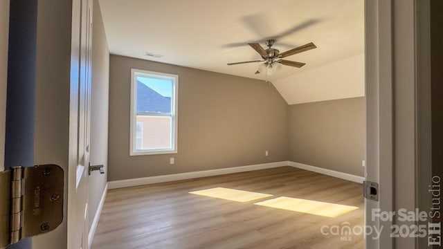 bonus room featuring vaulted ceiling, light wood-type flooring, and ceiling fan