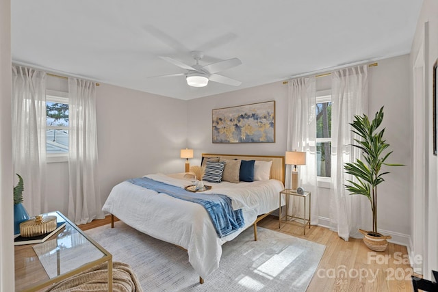 bedroom featuring light hardwood / wood-style floors and ceiling fan