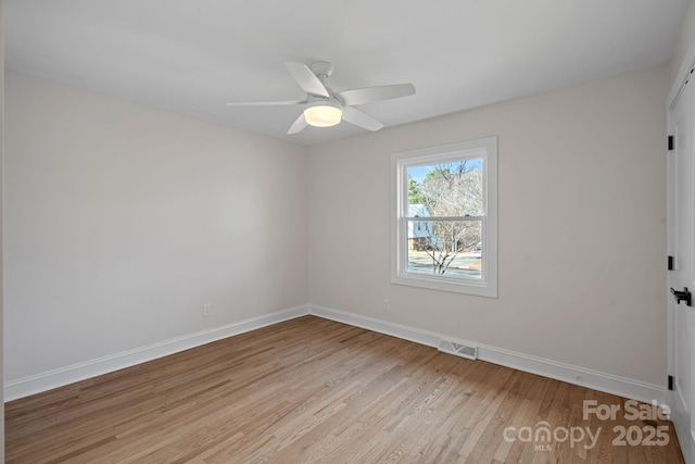 spare room with ceiling fan and light hardwood / wood-style floors