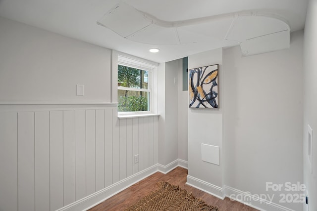 empty room with dark wood-type flooring