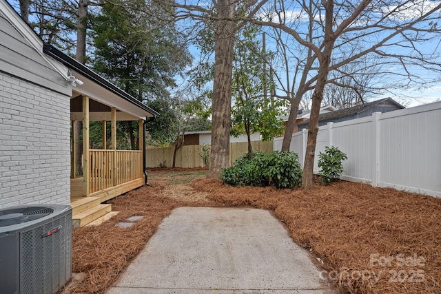 view of yard featuring central AC unit