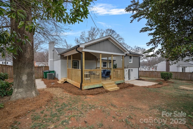 rear view of property with central air condition unit