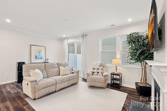 living room with dark hardwood / wood-style flooring and ornamental molding