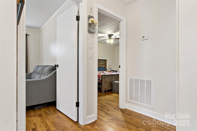 hallway with light hardwood / wood-style flooring