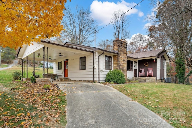 view of front of home featuring central AC, a front lawn, ceiling fan, and a porch