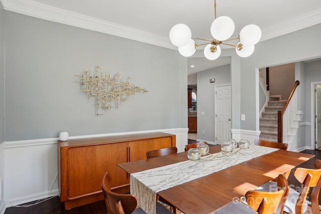 dining area featuring ornamental molding and a chandelier