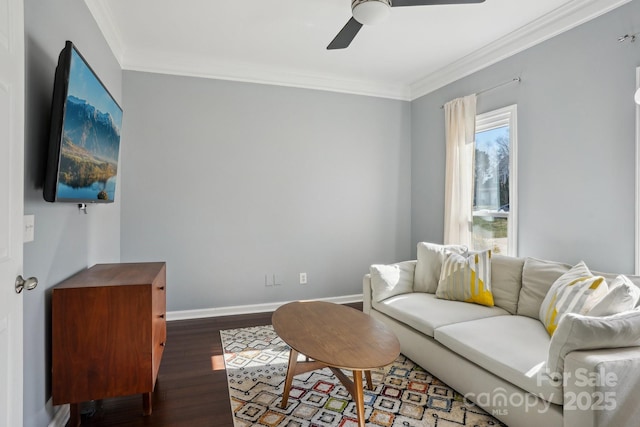 living room featuring ceiling fan, ornamental molding, and dark hardwood / wood-style floors