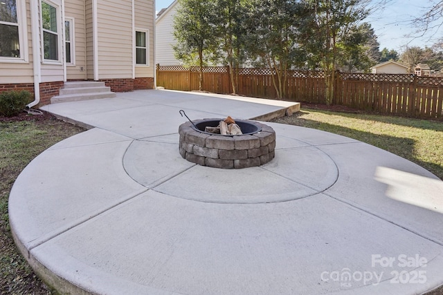 view of patio / terrace with a fire pit