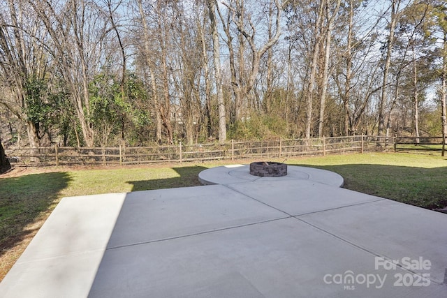 view of patio / terrace featuring an outdoor fire pit